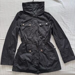 Deep green Calvin Klein windbreaker with high neck and packable hood